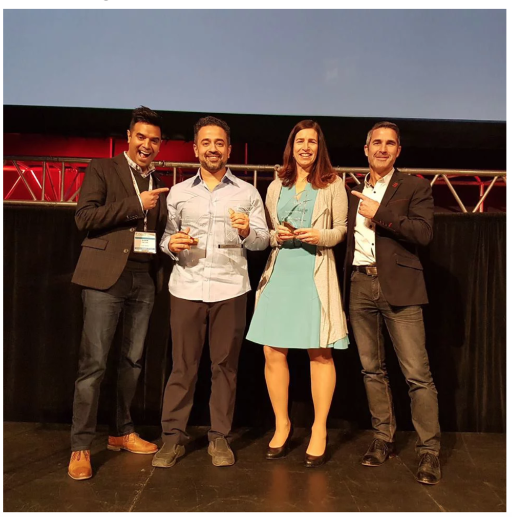 Symend's Hanif Joshaghani and Lendified's (now called Judi.ai) Monique Morden receiving prizes from Luge Capital partners, David Nault (extreme right) and Karim Gillani (extreme left)